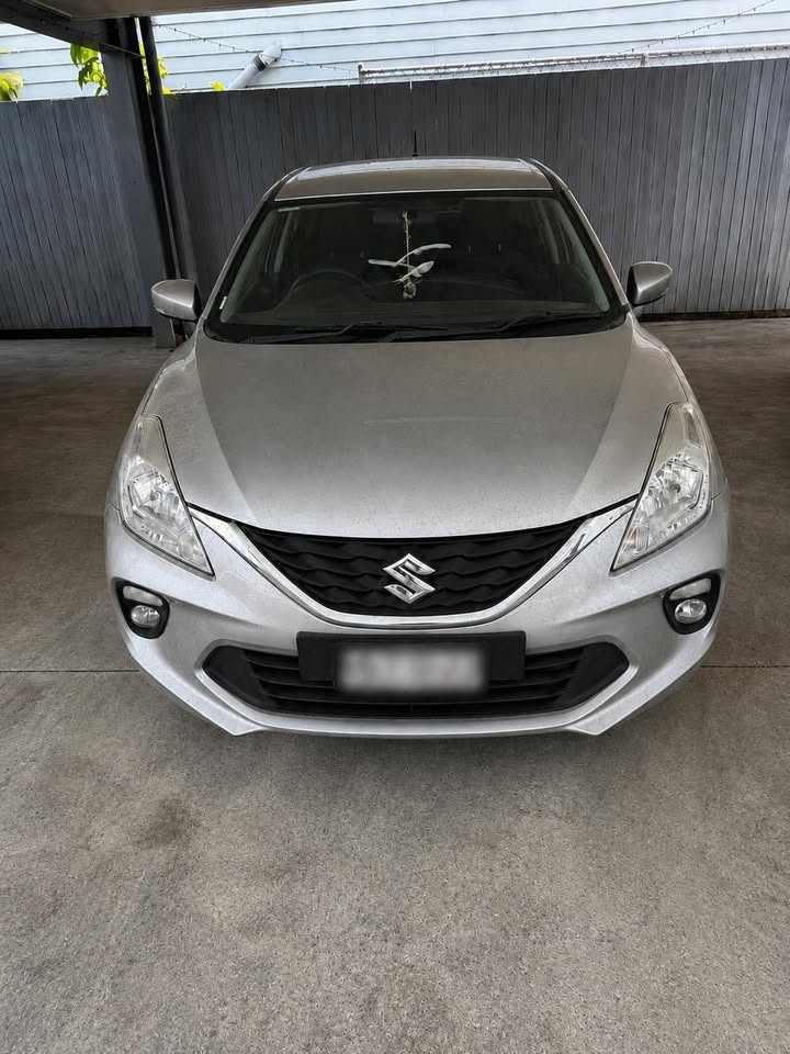 Silver Suzuki Baleno before detailing
