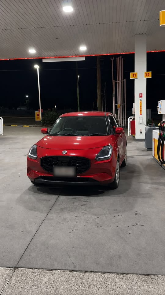 Red Suzuki Swift after detailing