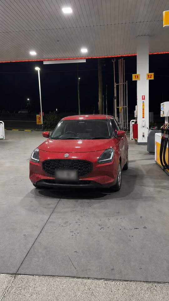 Red Suzuki Swift before detailing